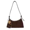 Bolsa de ombro de alta qualidade e estilosa para mulheres, nova coleção outono/inverno 2025, versátil para o trabalho e o trajeto, bolsa crossbody com design semelhante a um bolinho