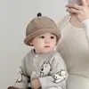 Chapéu de menino Chapéu de malha infantil de outono e inverno Chapéu de lã de bebê Pele de melão de menino Chapéu de proteção de ouvido de menina de estilo coreano para o inverno