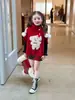 Nueva colección de otoño e invierno para niñas estilo coreano Ningli: lindo chaleco capa asimétrico rojo con tema de perro y falda de cuadros rojos