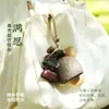 Cascabel Campana de Mano Carrillón Colgante de Bolsa Hecho a Mano Rayo de Sonido Cascabel Colgante Fruta Negra Indonesia Cáscara Fábrica Venta al por Mayor