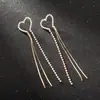 Pendientes de strass con temperamento europeo y americano pendientes dorados y plateados pendientes cadena simple borla pendientes largos E541