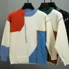 Suéter tejido de punto con diseño de bloques de color de invierno empalmado, cuello redondo, suéter pullover unisex moderno de corte holgado para pareja