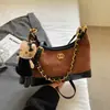 Bolso femenino súper popular de bloques de color de nicho, nuevo bolso cruzado versátil otoño e invierno 2026, bolso tipo empanada súper popular de un solo hombro para llevar debajo del brazo