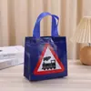 Bolsa no tejida con estampado de tráfico bolsa de regalo para niños bolsa de regalo navideño al por mayor bolsa de compras de ropa de dibujos animados