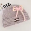 Gorro de tricô estilo coreano com mistura de lã, inspirado na dopamina, com laço, um chapéu de inverno quente e protetor de orelhas para mulheres, adequado para estudantes