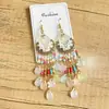 Pendientes largos con flecos de estilo étnico cruzado Pendientes de cristal bohemio Accesorios de viaje estilo vacaciones de verano en Yunnan