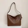 Bolso de mano de alta calidad con textura tejida 2026 nuevo elegante simple para llevar en la mano alto valor estético textura bolso de un solo hombro para debajo del brazo