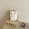 Bolso de diseño de nicho de alta calidad transfronterizo, nuevo bolso simple para teléfono móvil de mujer primavera 2026, bolso cruzado para el hombro y debajo del brazo