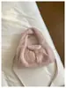Bolso de mujer elegante de alta gama 2026 nuevo de moda versátil de felpa de mano de un solo hombro moda retro bolso cubo