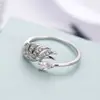 Ebay suministro Joyería europea y americana moda dinámica anillo forma de alas cobre chapado en oro micro incrustado circonio fábrica en stock