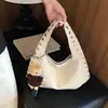 Bolso pequeño cuadrado texturizado transfronterizo 2026 nuevo bolso de mano de verano bolso de hombro de moda con tachuelas bolso grande de capacidad para el hombro para mujer