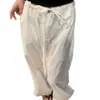 Pantalones blancos minimalistas ultrarrápidos de Tencel, estilo fino primavera-verano 2026 para personas petite, con pretina única en forma de capullo y piernas anchas.