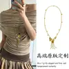 ¡Estilo Artístico Vintage! Collar Largo con Borla de Concha Dorada para Mujer Cadena para Suéter Estilo Retro Francés de Vacaciones Clavícula