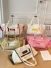 Bolso tote de lona de gran capacidad para mujer, nicho transfronterizo, nuevo bolso de mano y bandolera casual ligero para el verano de 2026