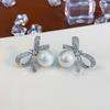 Pin de plata 925 con pendientes de perlas de lazo de circonio Corea del Sur pendientes de temperamento de alto sentido pendientes de otoño e invierno venta al por mayor