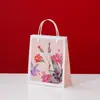 Bolsa de oreja de tenedor portátil de plástico Bolso de mano de regalo con carta manual de Comercio Exterior Bolsita plana especial para tienda libre de impuestos hdpe Mano de bolsa de compras
