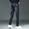 Jeans de Sarja Masculino para Atacado Primavera e Outono Marca da Moda Calças Casuais Retas Largas Moda Calças Masculinas Lavadas em Água Elásticas Versáteis Calças Compridas