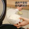 La cuchara de arroz de cocina tipo ventosa puede ser una olla arrocera vertical antiadherente de grado alimenticio resistente a altas temperaturas para uso doméstico.