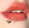 Comércio exterior europeu e americano em estoque prego de lábio com dentes externos em formato de coração 1.2 joia de piercing para osso da orelha prego de orelha atacado transfronteiriço