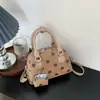 Bolso Shuai Mi Jia elegante y moderno de nicho de lunares para mujer, nuevo bolso cruzado de otoño 2026 para el trabajo, bolso de mano, bolso almohada