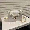 Bolsas Elegantes de Personalidade Tecidas para Comércio Exterior 2026 Moda Casual Bolsa de Ombro Transversal Tendência Feminina Pequena Quadrada Texturizada