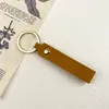Chaveiro de metal em couro artificial PU couro de dupla face -2 couro pequeno chaveiro de presente anel de metal pingente simples 6g