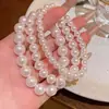 Pulseira Clássica de Pérolas para Mulheres, Semelhante ao Estilo da Shijia, com um Toque de Luxo Leve e Sofisticado, Apresentando Cordão Elástico e Delicadas Miçangas de Arroz para Empilhamento