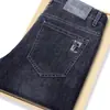 Jeans para hombre Guangzhou Xintang, nuevo modelo otoño 2026, corte recto holgado, pantalones largos de seda helada de alta gama de moda para hombre