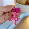 Pelota láser de dibujos animados para perro estilo ins colgante amor DIY pareja accesorios para bolso de mujer pequeño regalo llavero al por mayor