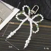 Nuevo Colgante Creativo de Cadena Colgante con Lazo de Perlas para Bolso, Funda de Teléfono, Llavero, Adorno, Exquisito Accesorio de Regalo Pequeño