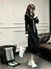 Vestido de otoño e invierno estilo Chanel para mujer, nuevo modelo 2026, entallado en la cintura, adelgazante, elegante, rejuvenecedor, vestido negro extremadamente hermoso