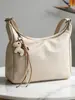 Bolsas de Moda Transfronteiriças para Mulheres Verão 2026 Nova Tendência Versátil Casual Bolsa Transversal Design de Nicho Bolsa de Ombro Formato de Bolinho
