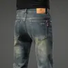 Jeans retro de alta gama para hombre, pantalones rectos de corte ajustado, pantalones versátiles elásticos de marca de moda, nuevo modelo primavera 2026