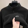 Venta al por mayor de fábrica de chaquetas cálidas de forro polar, nueva colección otoño/invierno 2026, sudaderas de forro polar para hombre, cárdigan con cuello alto para exteriores