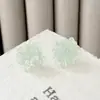 Pendientes pequeños de hielo fresco transparentes de colores con diseño de flor para mujer, diseño dulce de nicho, pendientes versátiles para el día a día, pendientes de alto valor
