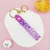 Llavero Colgante de Cordón de Cuero con Letra Transparente Brillante con Accesorios Estilo Muñeca Rellena de Aceite Encanto de Llavero Pulsera Venta al por Mayor