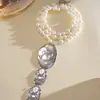 Collar de perlas en capas con cuentas transfronterizo europeo y americano, cadena para la clavícula estilo fiesta vintage, lujo ligero, accesorio versátil de alta gama para mujer