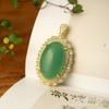 Colgante de huevo de jade dorado de Xinjiang con superficie de lujo con incrustaciones de jade Dongling Colgante de jade Regalo Joyería Venta al por mayor