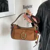 Nueva moda de nicho para ir al trabajo 2026 estilo coreano retro súper popular bolso cruzado, bolso de hombro, bolso de ante versátil para mujer bajo el brazo