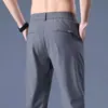 Pantalones Casuales de Hombre Verano Delgados Estilo Coreano Gama Alta Elásticos Ajustados con Cremallera Antirrobo Color Sólido Secado Rápido Pierna Recta