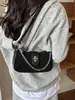 Bolsa de ombro com alça de trava, design de nicho, bolsa transversal para o dia a dia, versátil, estilosa, simples, bolsa de mão moderna