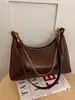 Bolso de axila tipo dumpling retro de nicho estilo coreano para mujer, nuevo bolso cruzado de alto valor 2026, bolso de hombro casual para el día a día
