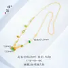 Tienda de oro con el mismo estilo flor de arena dorada candado de paz collar para mujer bolsa candado esmaltada cadena colgante estilo retro sentido de alta gama