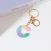 Llavero de Resina Color Arcoíris Letra Inglesa Borla Colgante Creativo Alto Sentido Gota de Pegamento de Cristal Colgante de Bolso