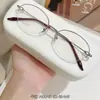 Armazones de anteojos de titanio puro para mujer, estilo business tradicional, colección de anteojos de medio aro ultraligeros, armazón de anteojos Danyang M0043