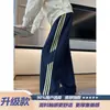 Calça de moletom listrada estilo americano azul-marinho para homens, calça esportiva de verão reta de corte solto, calça casual versátil da moda com bom caimento