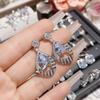 Pendientes de camelia con lazo brillante de circonita y diamantes, chapados en oro de 18 quilates, diseño de borlas de temperamento de alta calidad, exquisitos pendientes