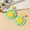 Aretes de isla hechos a mano de girasol de rafia y pasto, aretes de flores grandes exagerados de personalidad junto al mar, venta al por mayor de aretes