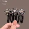 Peine de inserción lateral de alta gama, nueva herramienta para arreglar el cabello, lujoso y exquisito peine de flor de cristal 2026 para mujer