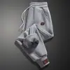 Pantalones Casuales de Moda con Tobillo Atado para Hombre Otoño e Invierno Forrados de Polar Moda Calentador Interior Pantalones Deportivos Sueltos para Estudiante